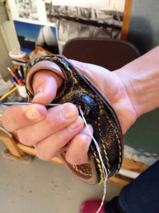 Sail maker's palm for sewing with needle and thead.