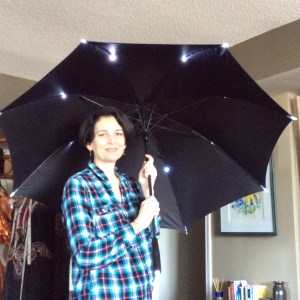Roz showing me one of the light-up umbrellas her father imported.