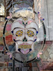 Day of the Dead stained glass in  Gastown window.